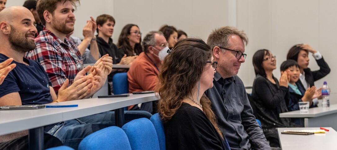 delegates sitting in lecture theatre