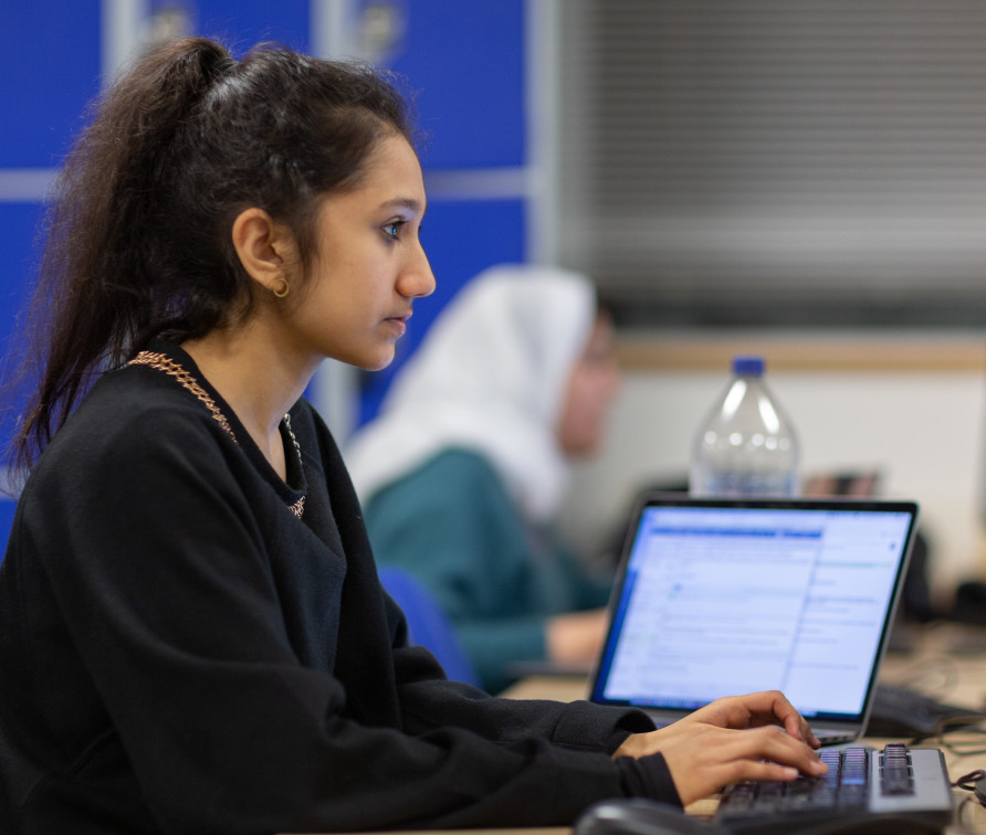 Student working on a computer in the computing lab