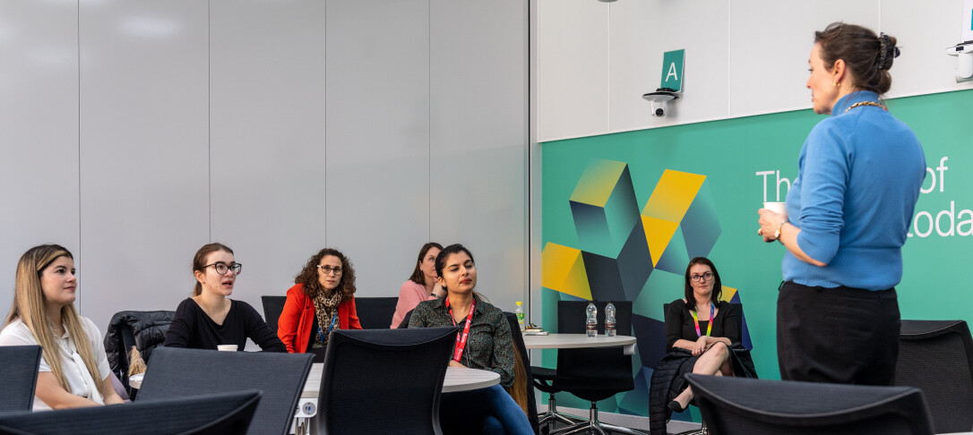 A person standing in front of a group of people