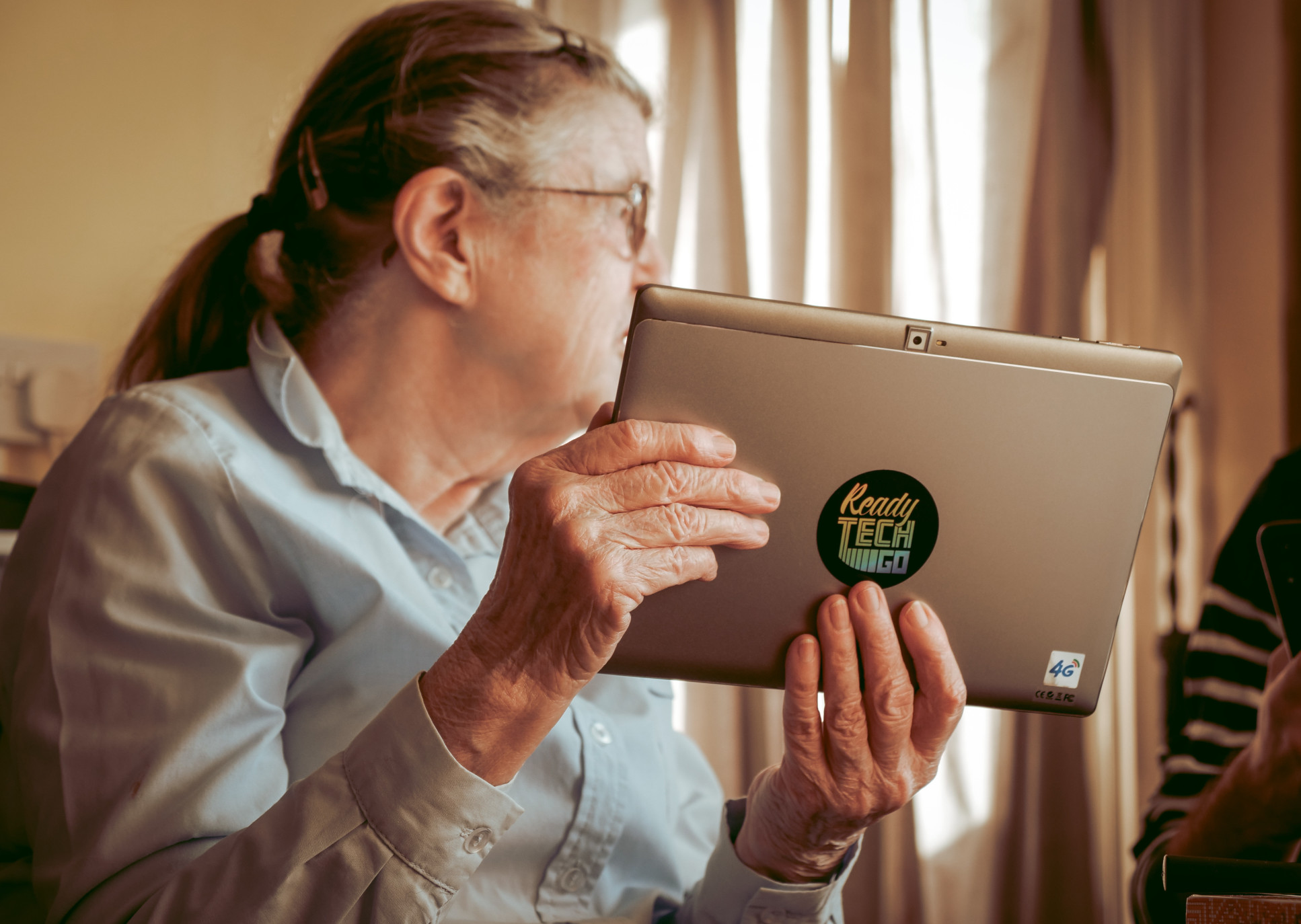 Older recipient of a donated laptop
