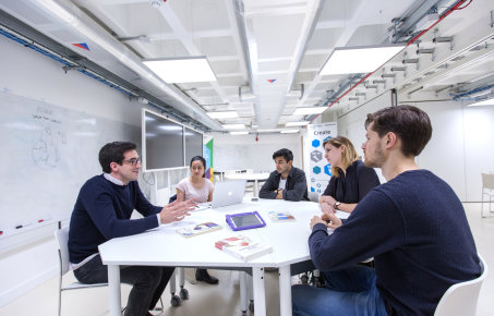 Meeting taking place with five people in the Enterprise Lab