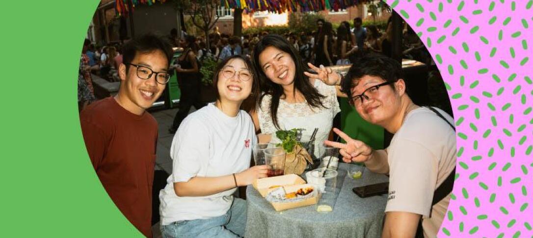 Students smiling and socialising in Beit Quad