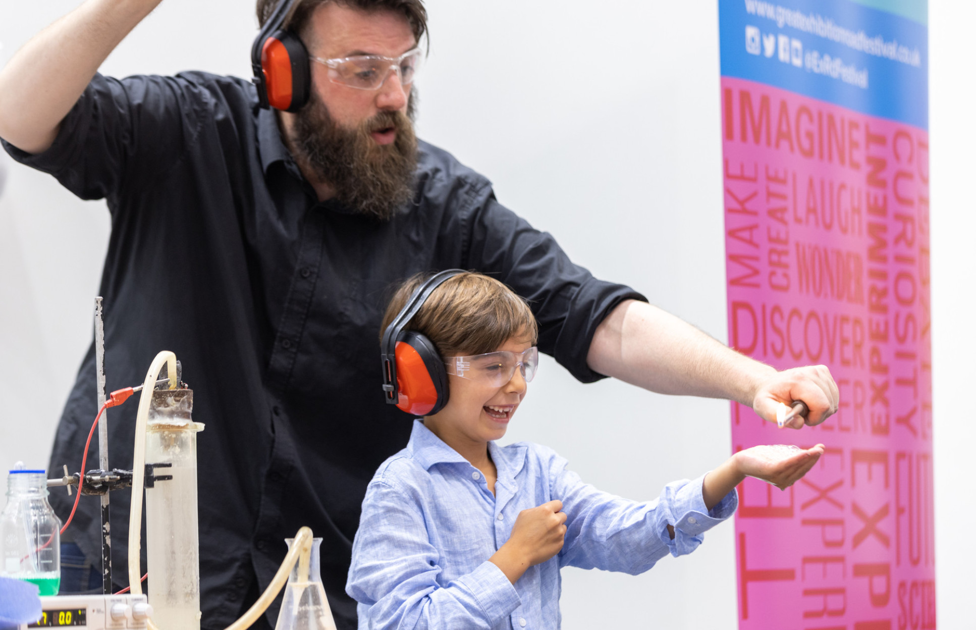 Science show presenter and child