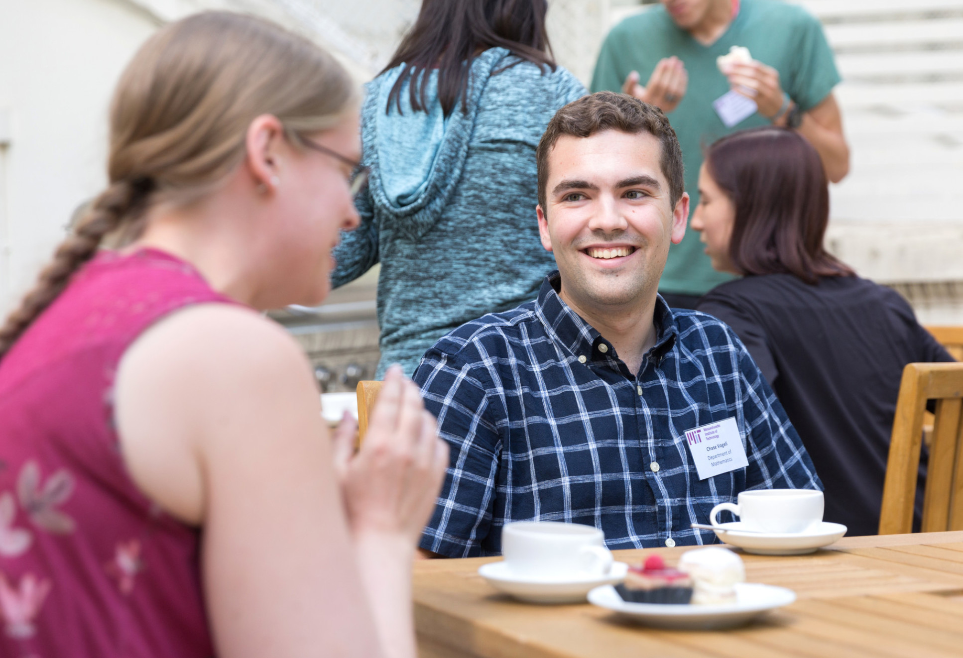 A student at an afternoon tea event