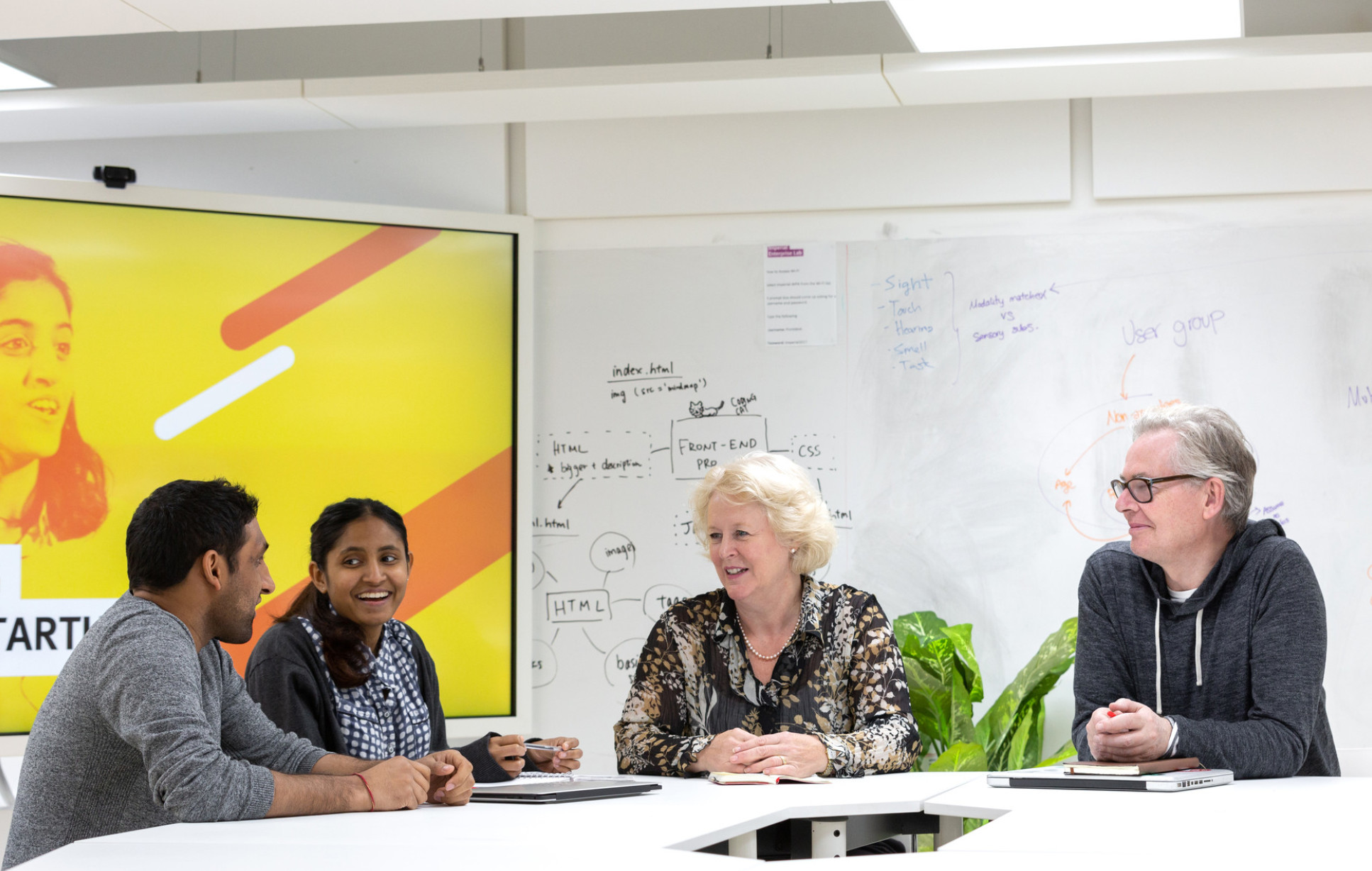 	IVMS mentors Paul Dowling and Dominique Klein in conversation with student entrepreneurs in the Enterprise Lab