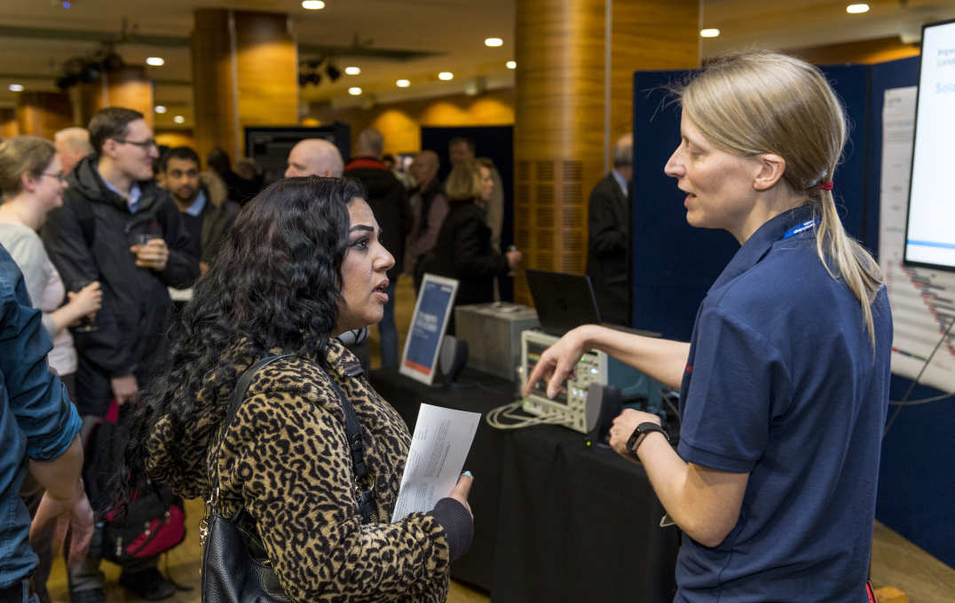 A researchers and a woman talking