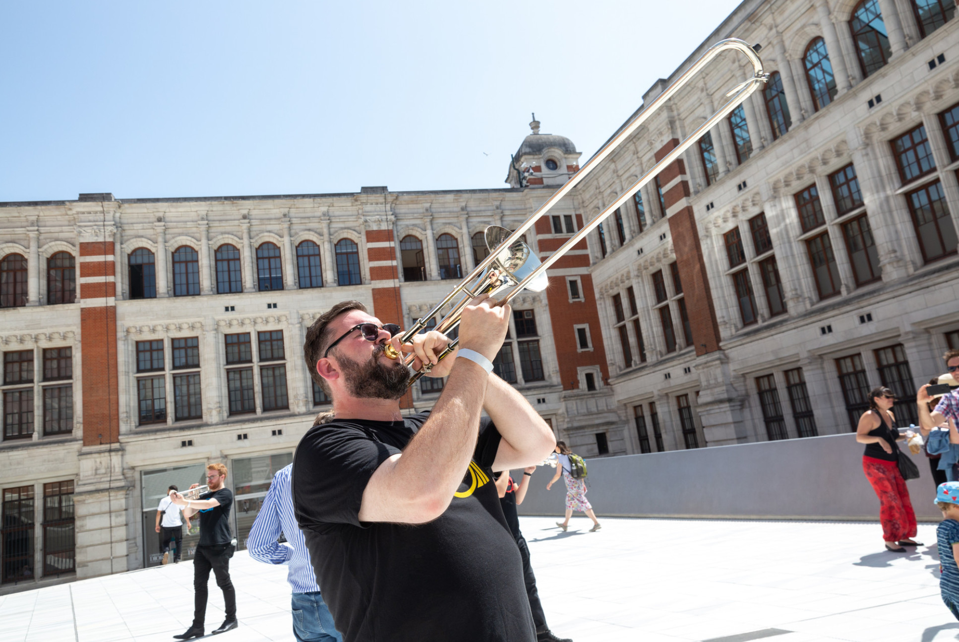 A trombonist in the V&A courtyard