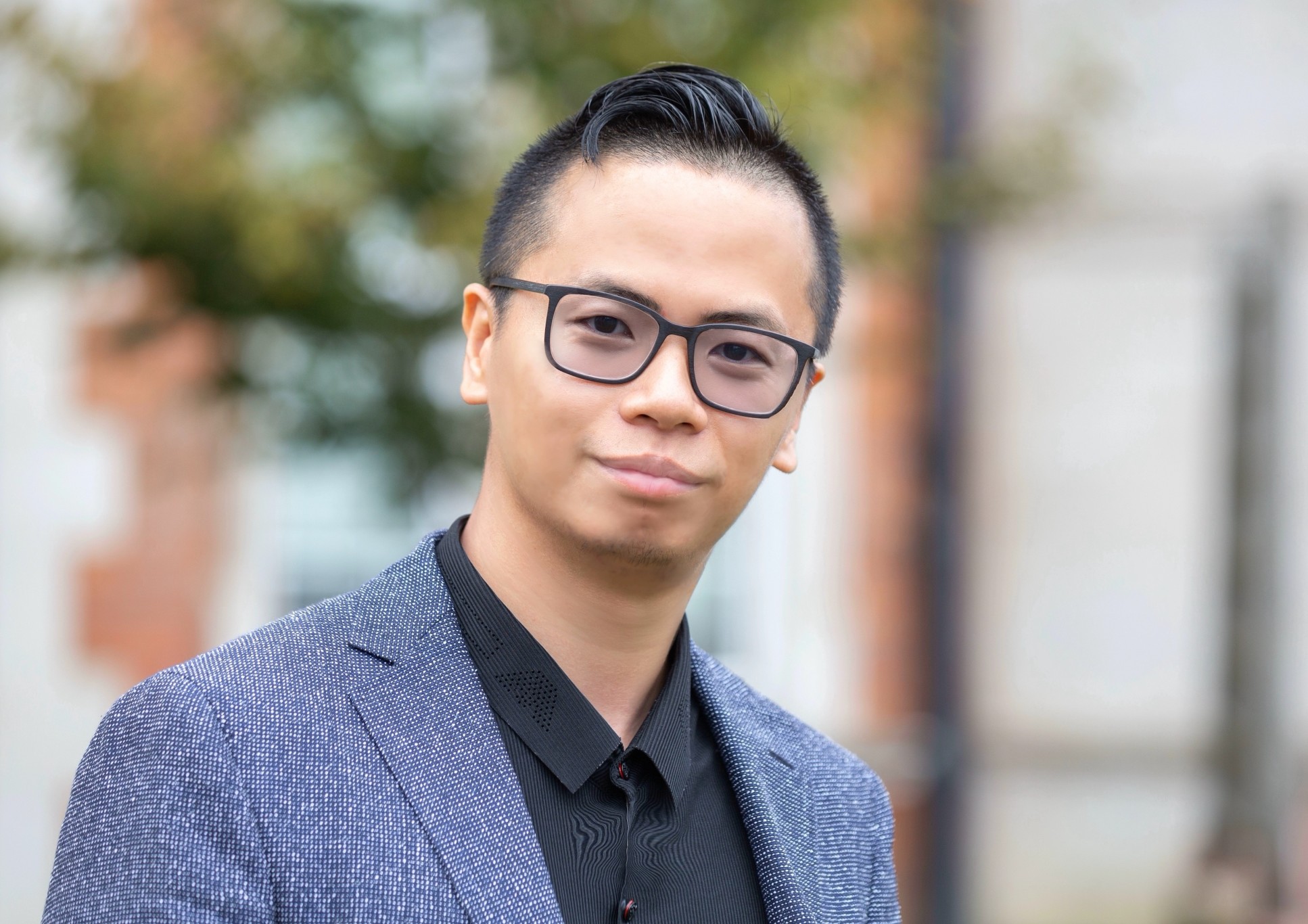 Asian man with glasses in suit