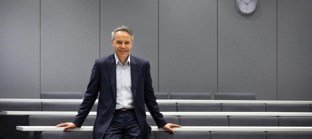 Man standing in a lecture theatre