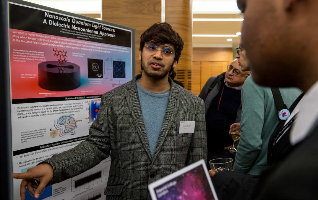 A student explains his poster