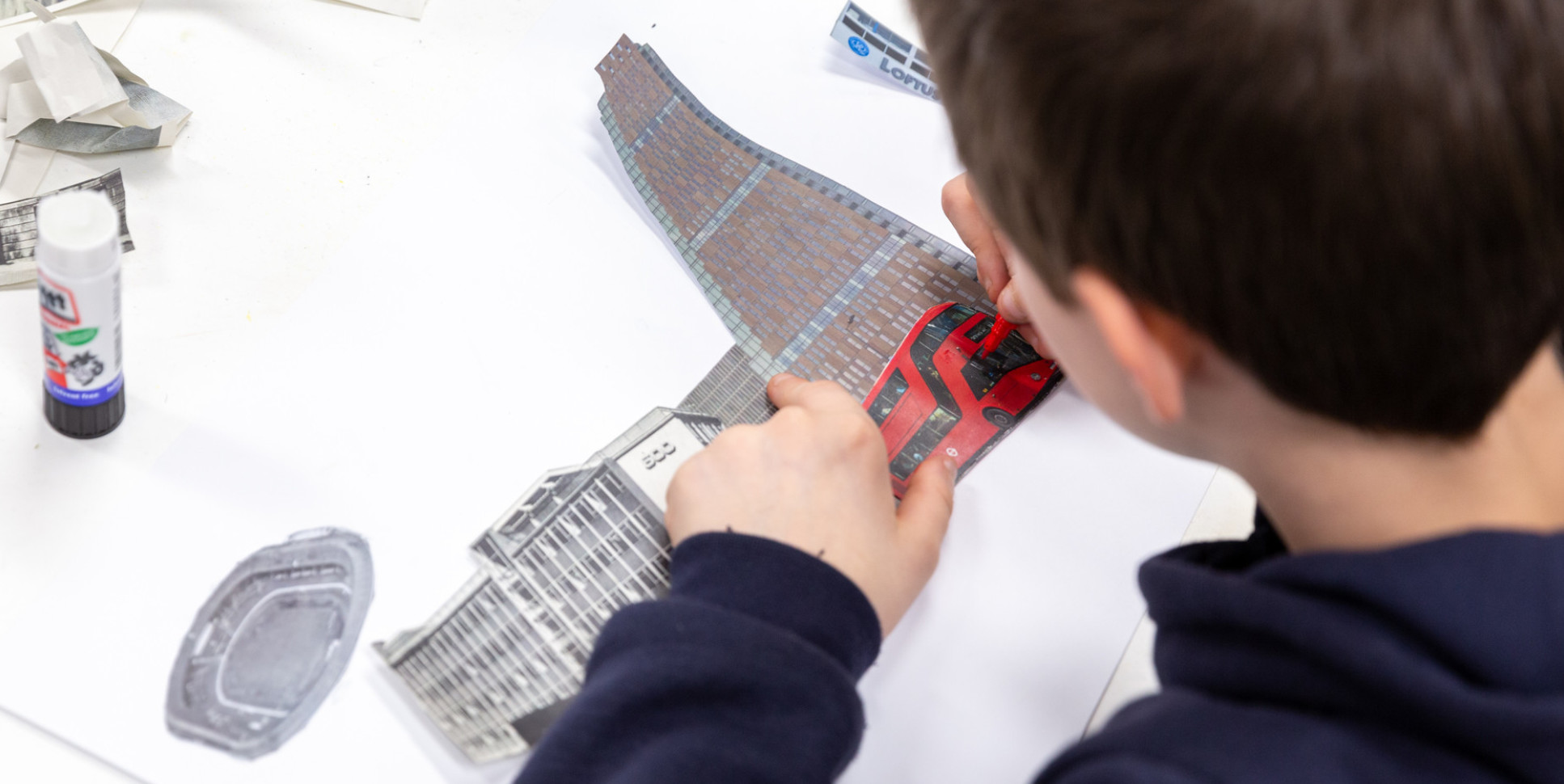 A school student learning about the materials used in the construction of London buildings.