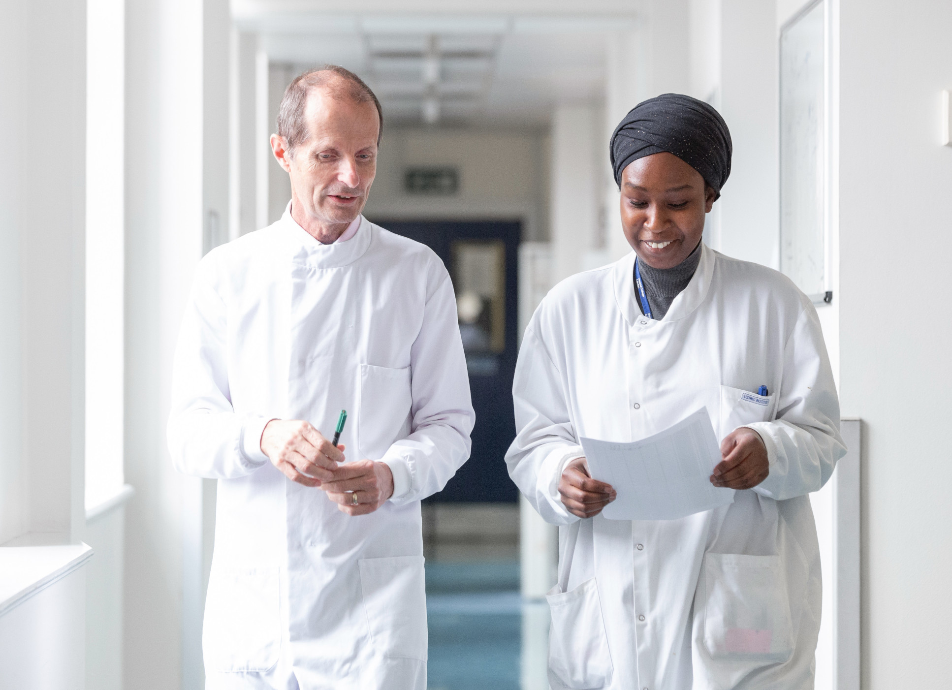 Man and woman in lab corridor