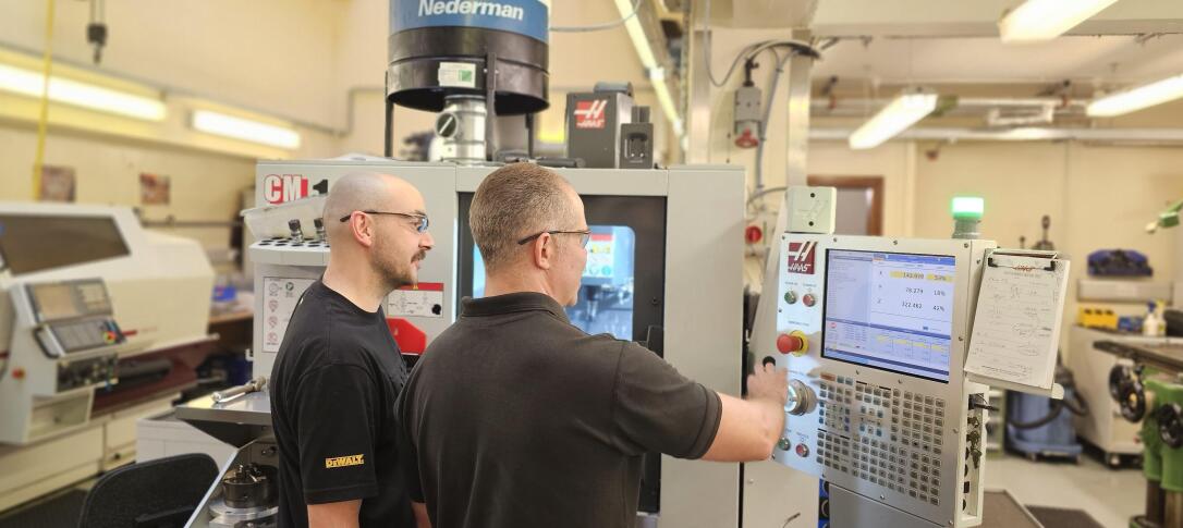 Two scientists working in the Mechanical Instrumentations Workshop