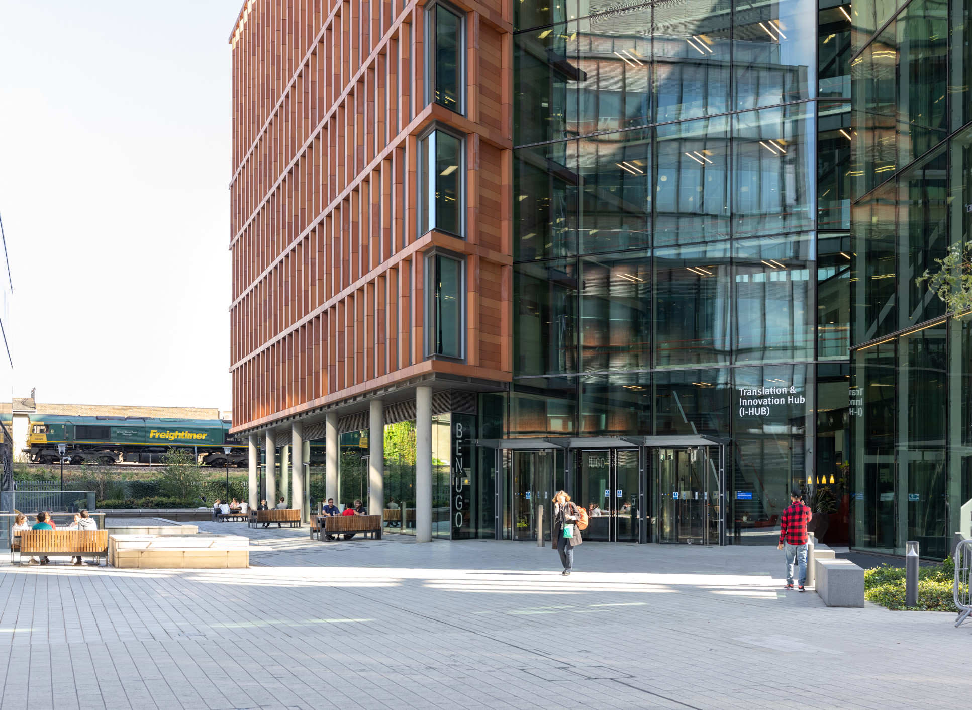 The entrance to a large, glass-fronted building