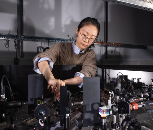 An image of a person in a physics lab