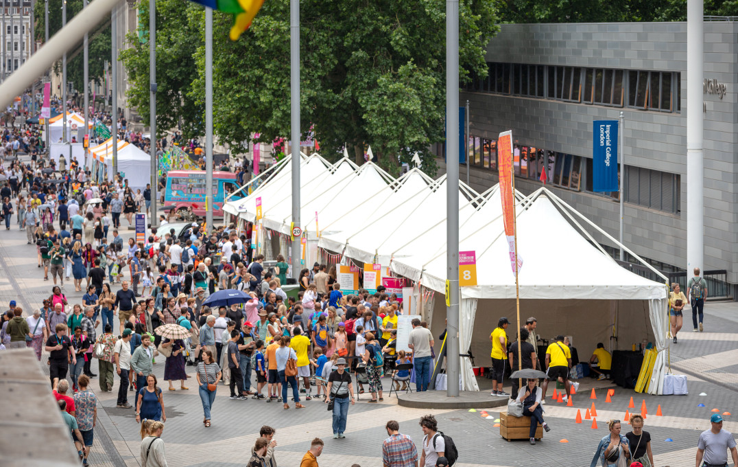 Exhibition Road lined with tents, stands, and visitors 
