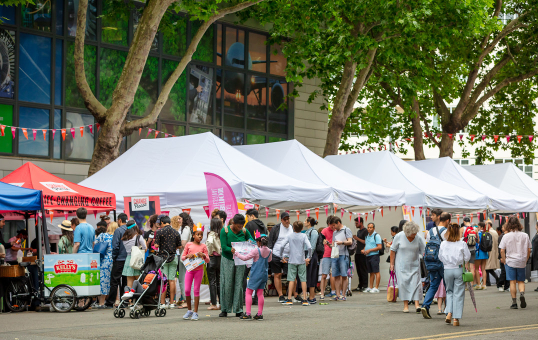 A row of exhibition tents on Imperial College Road and bustling with visitors