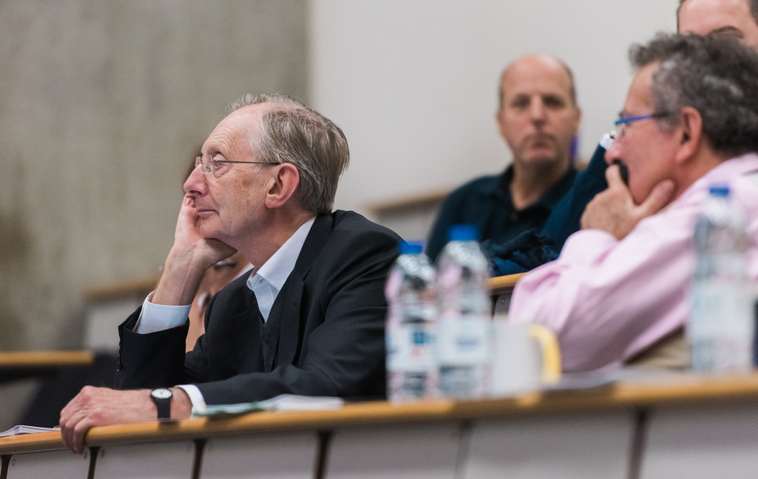 Professor Sir John Pendry watches a presentation at the Make a Difference final.