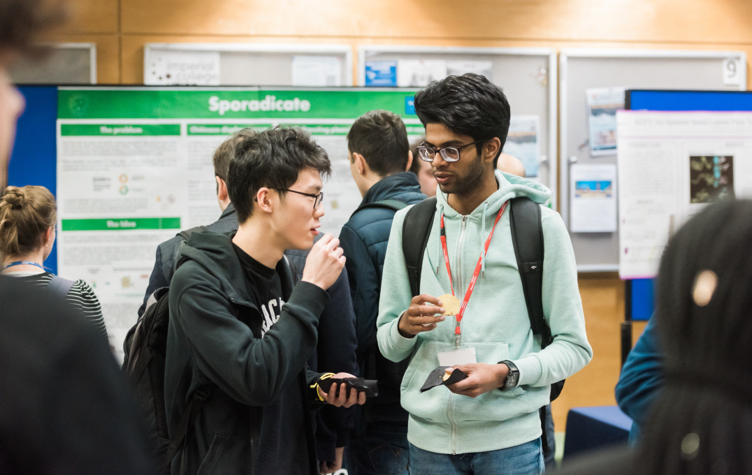 Two audience members talking after the final event.