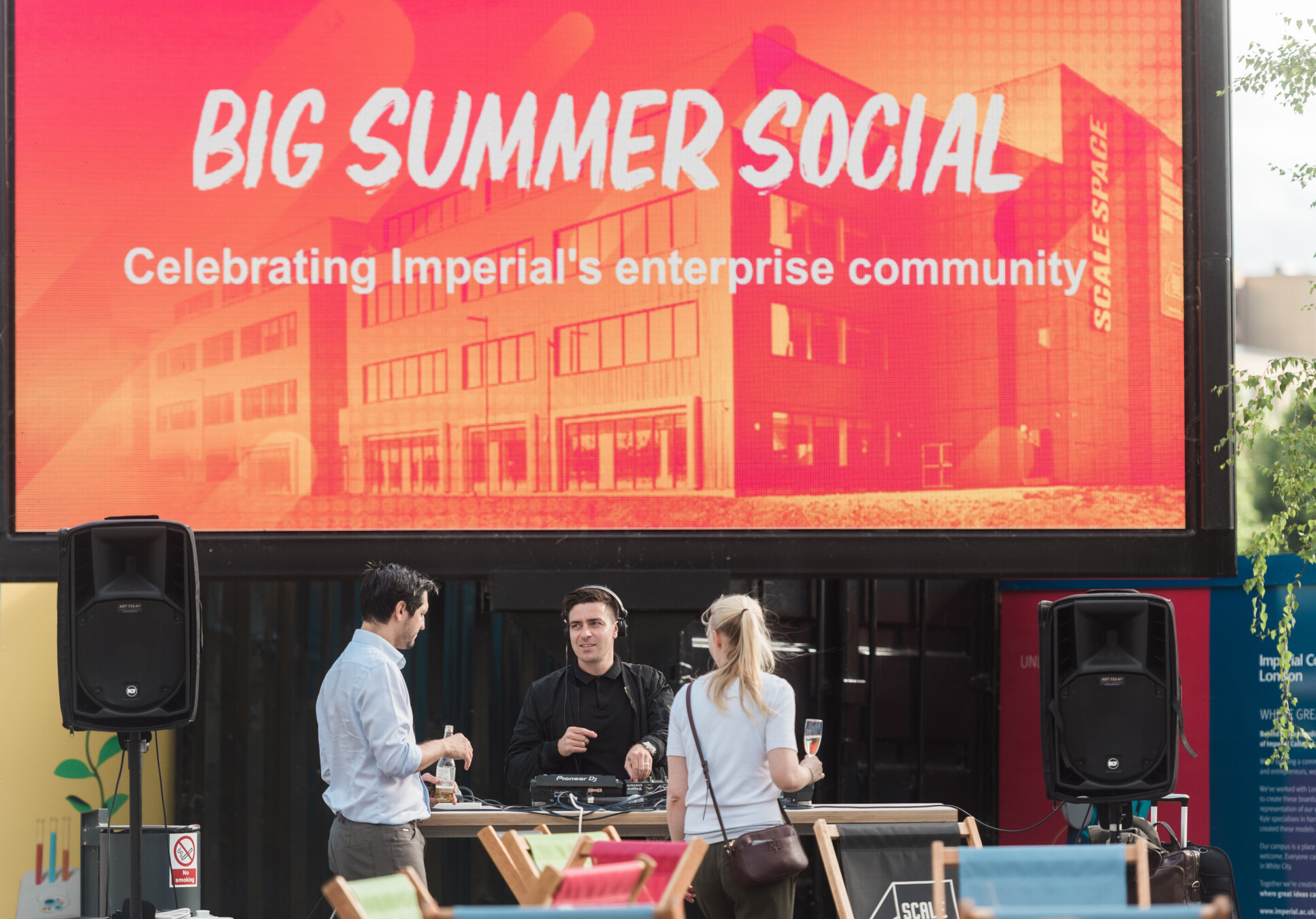 A large screen shows the text 'Big Summer Social - Celebrating Imperial's enterprise community'. 