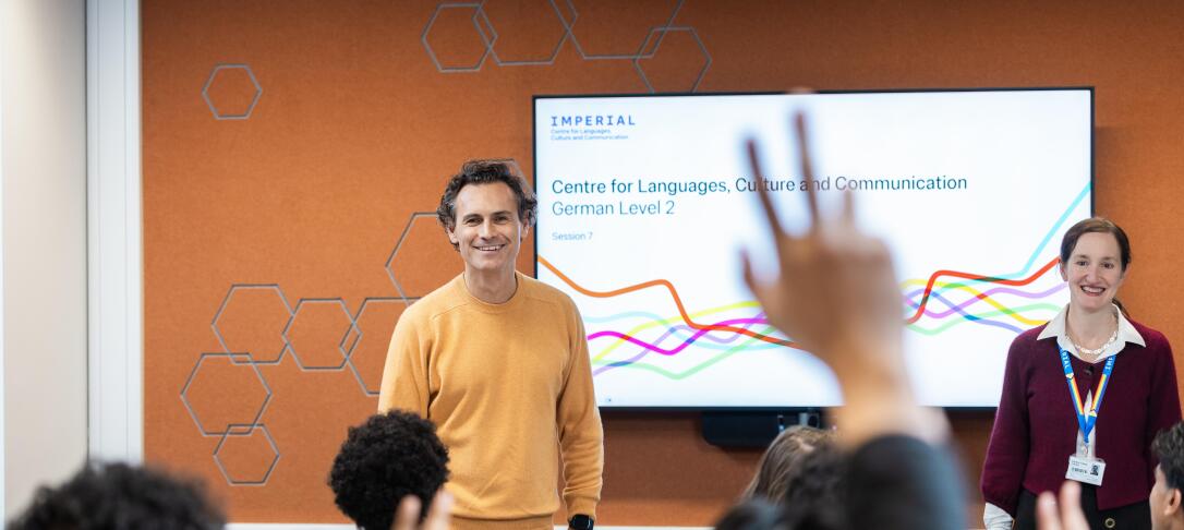 Student raising hand in classroom