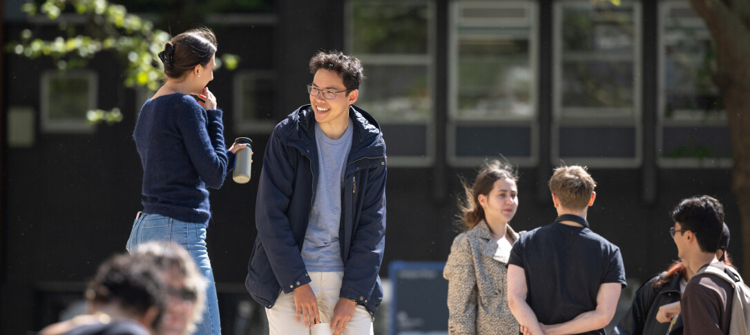 students having a conversation outdoors