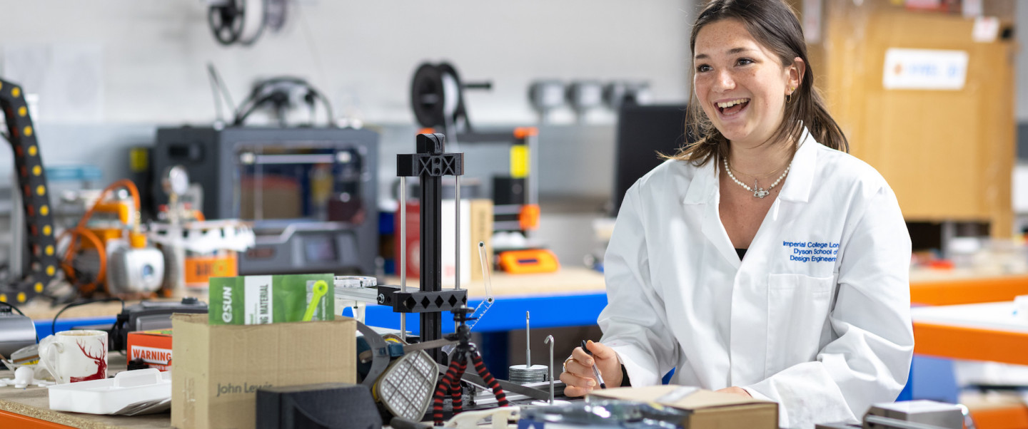 A female student smiling in a lab