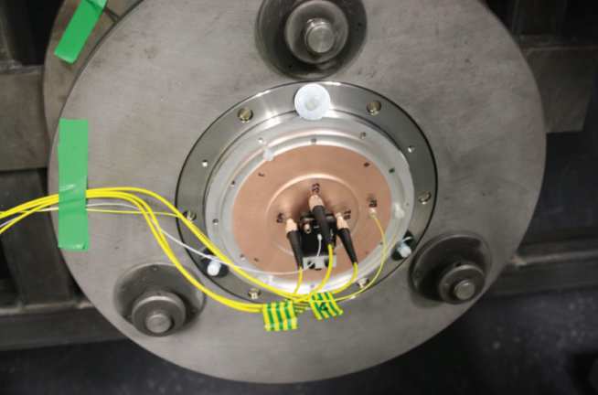 Figure 34: The reverse ballistic copper target installed within the large bore gas gun. An array of Het-V probes were used to monitor the rear-surface velocity of the copper target impacted by the concrete flyer