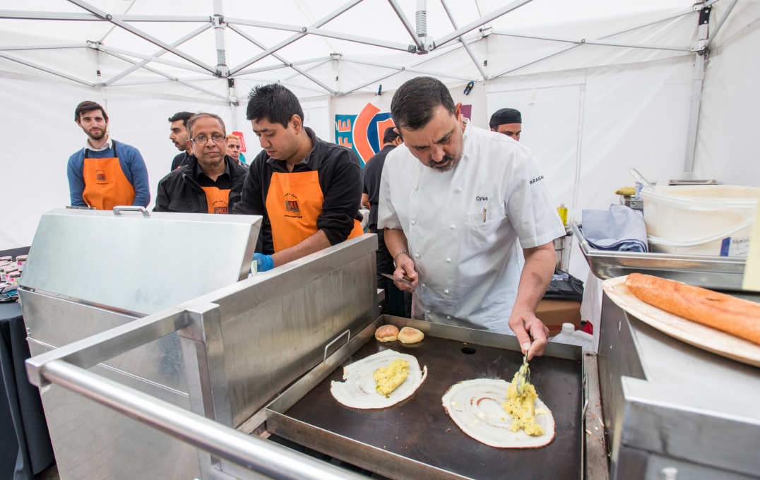 An Indian chef makes roti pancakes