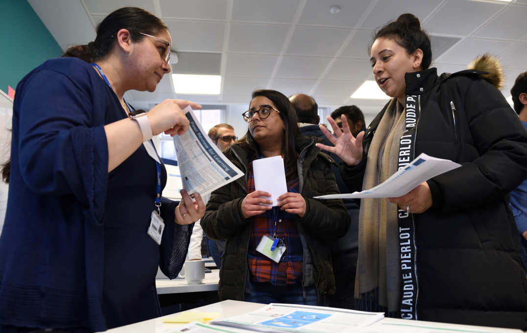 Attendees speaking with one another