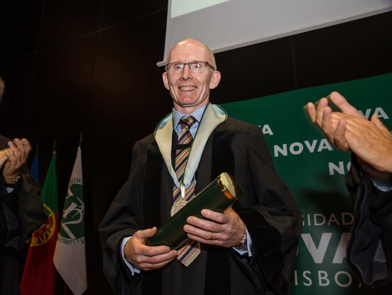 Andrew Livingston holding award