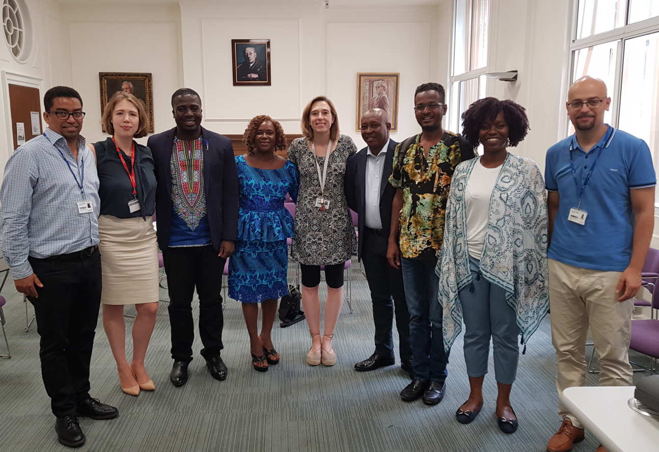 Representatives of the universities pose for a photograph