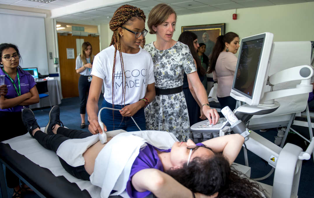 A student learns how to operate an ultrasound scanner