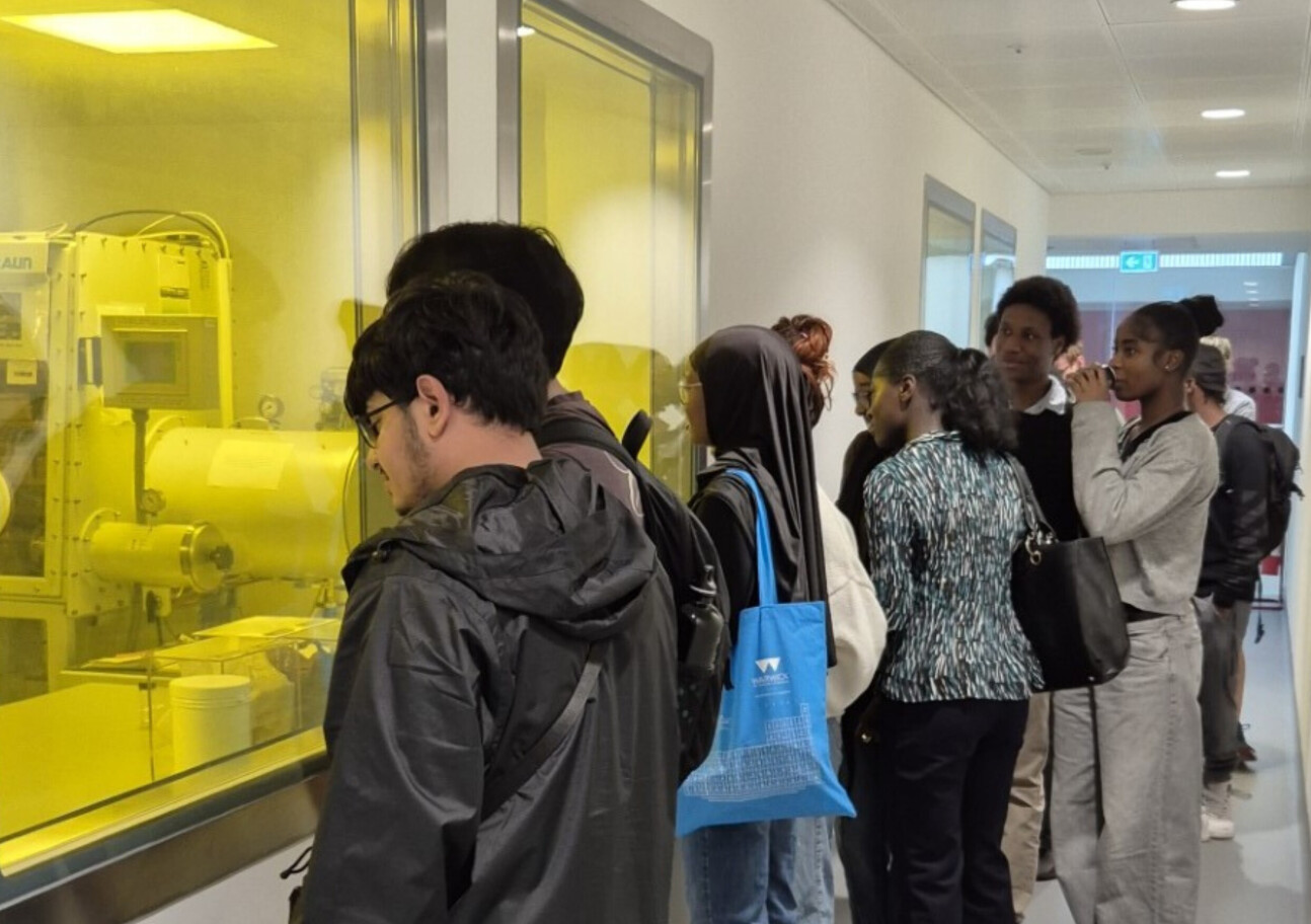 Students outside lab with yellow lighting