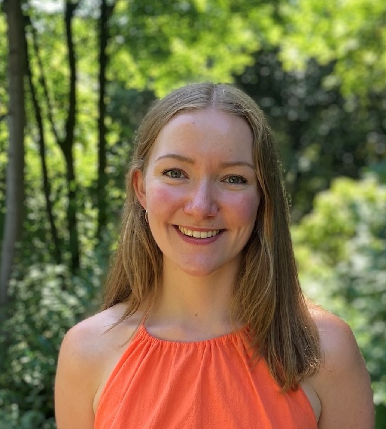 Amy Smith with a wooded background