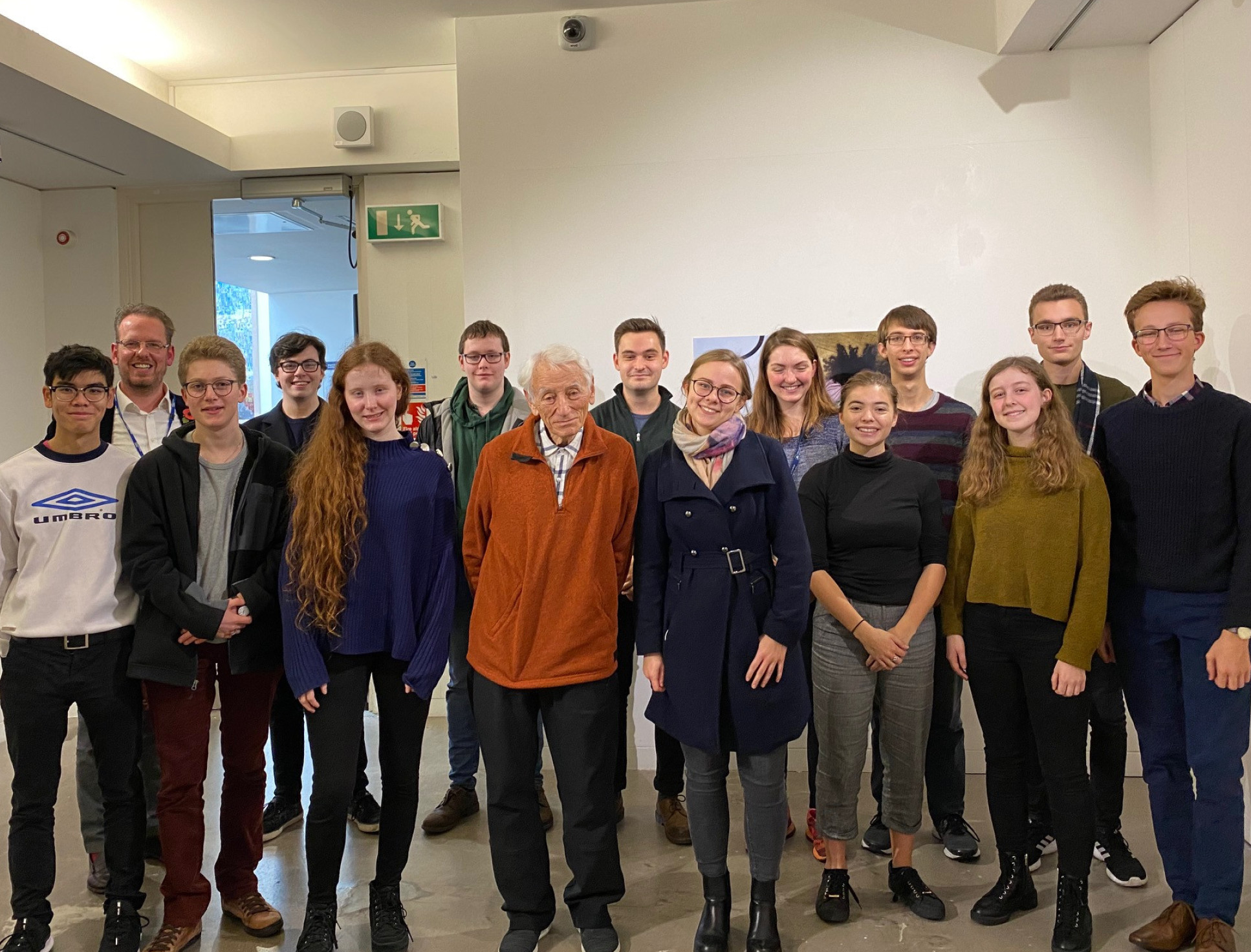 Group of students and one elderly man