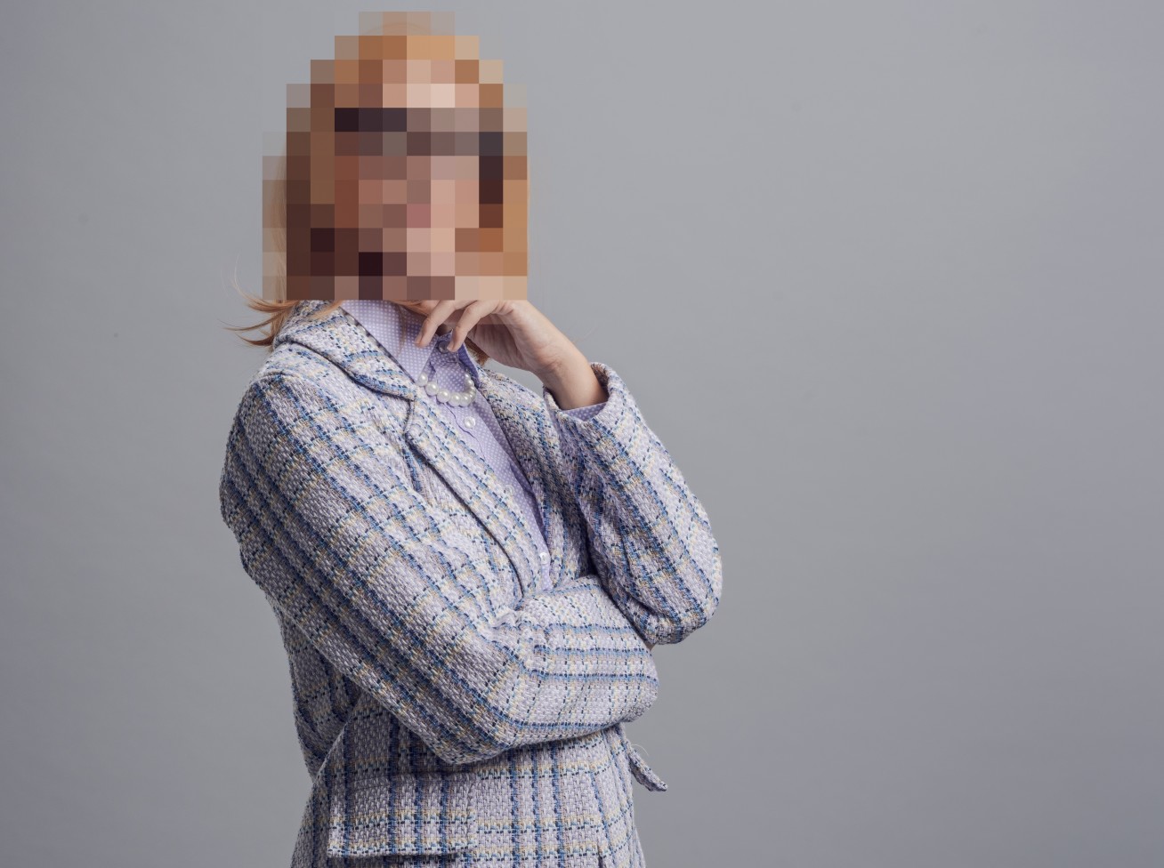 Image of a person with their face pixelated.