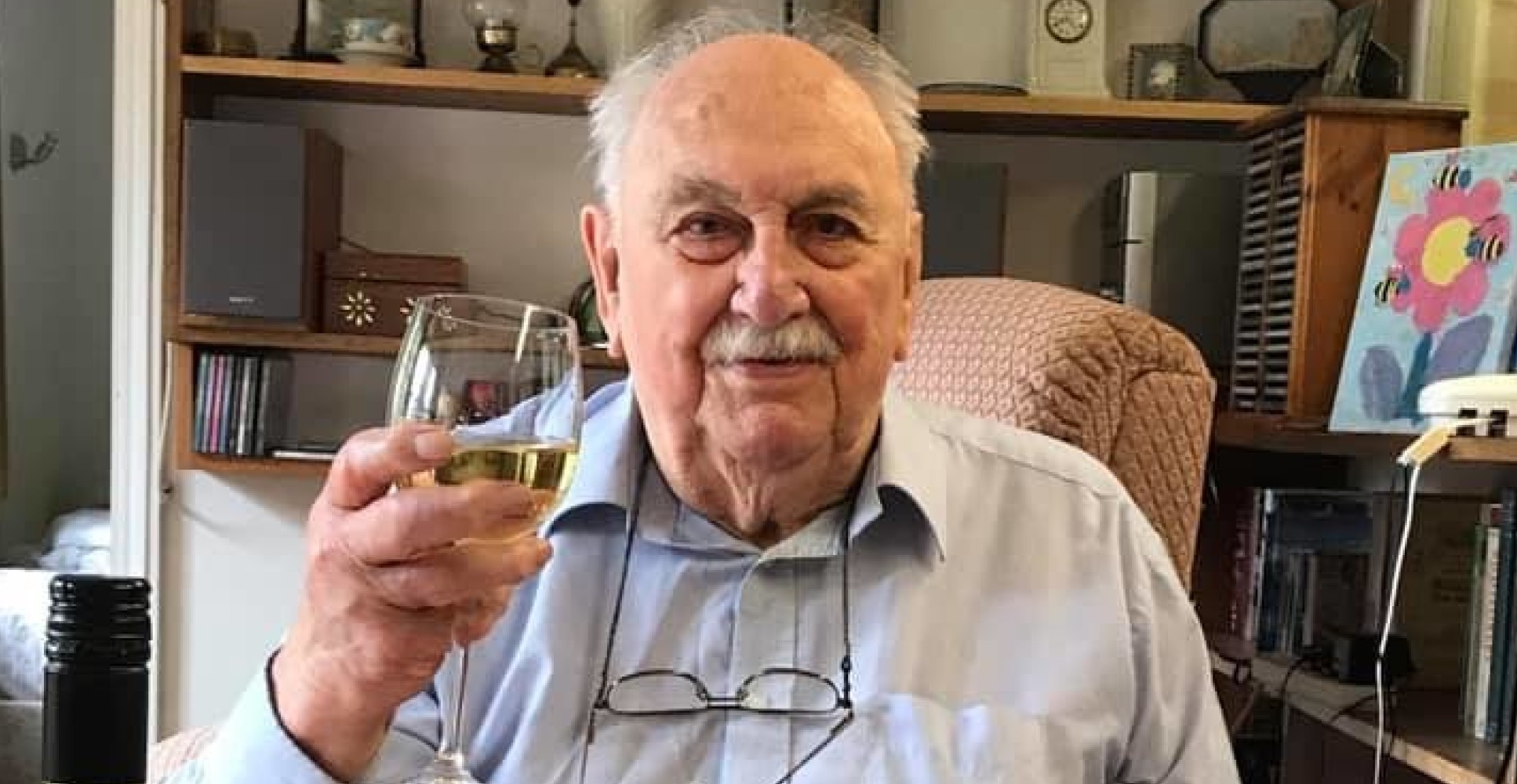 A photo of Brian Selby Hartley FRS at home at the dining table with a glass of wine