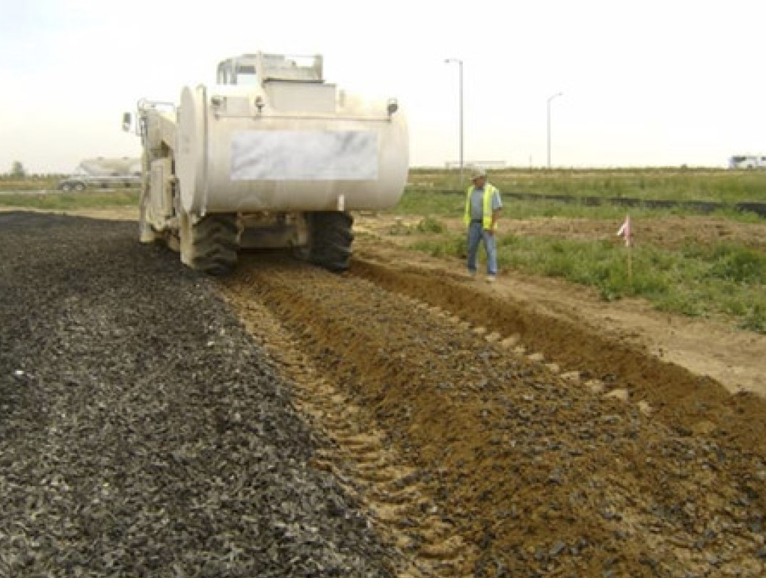 Road construction using tyre rubber-soil technology