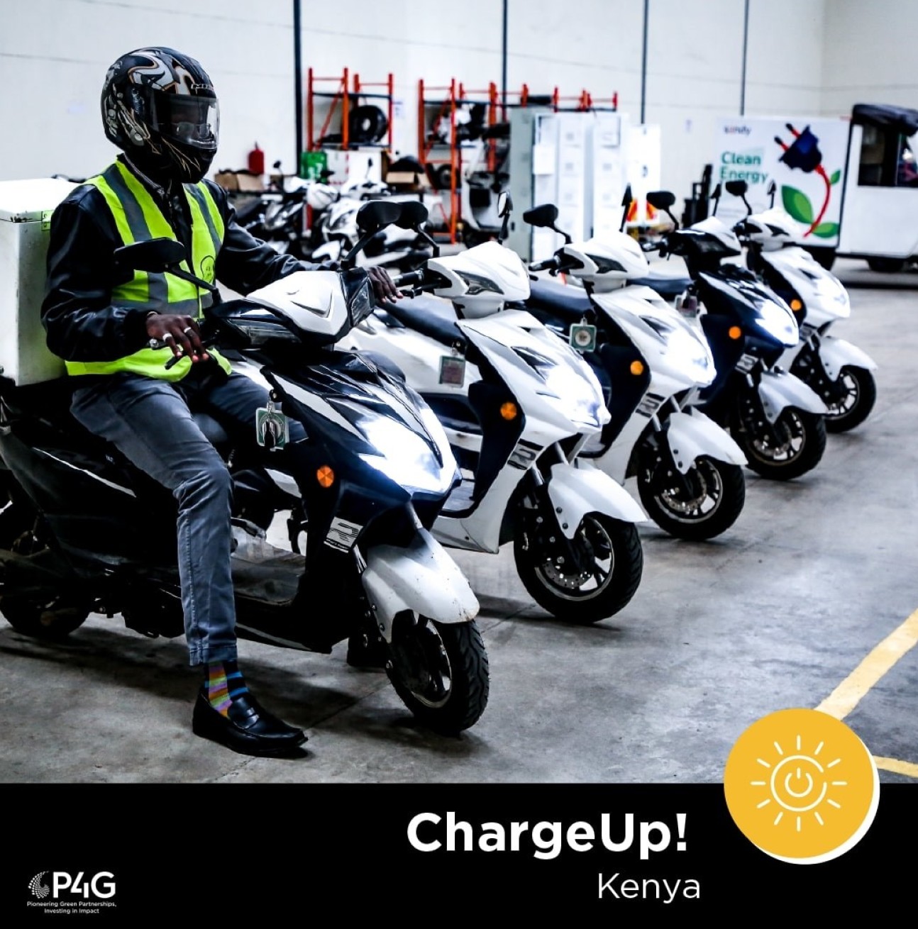 A man sits on an electric motorbike