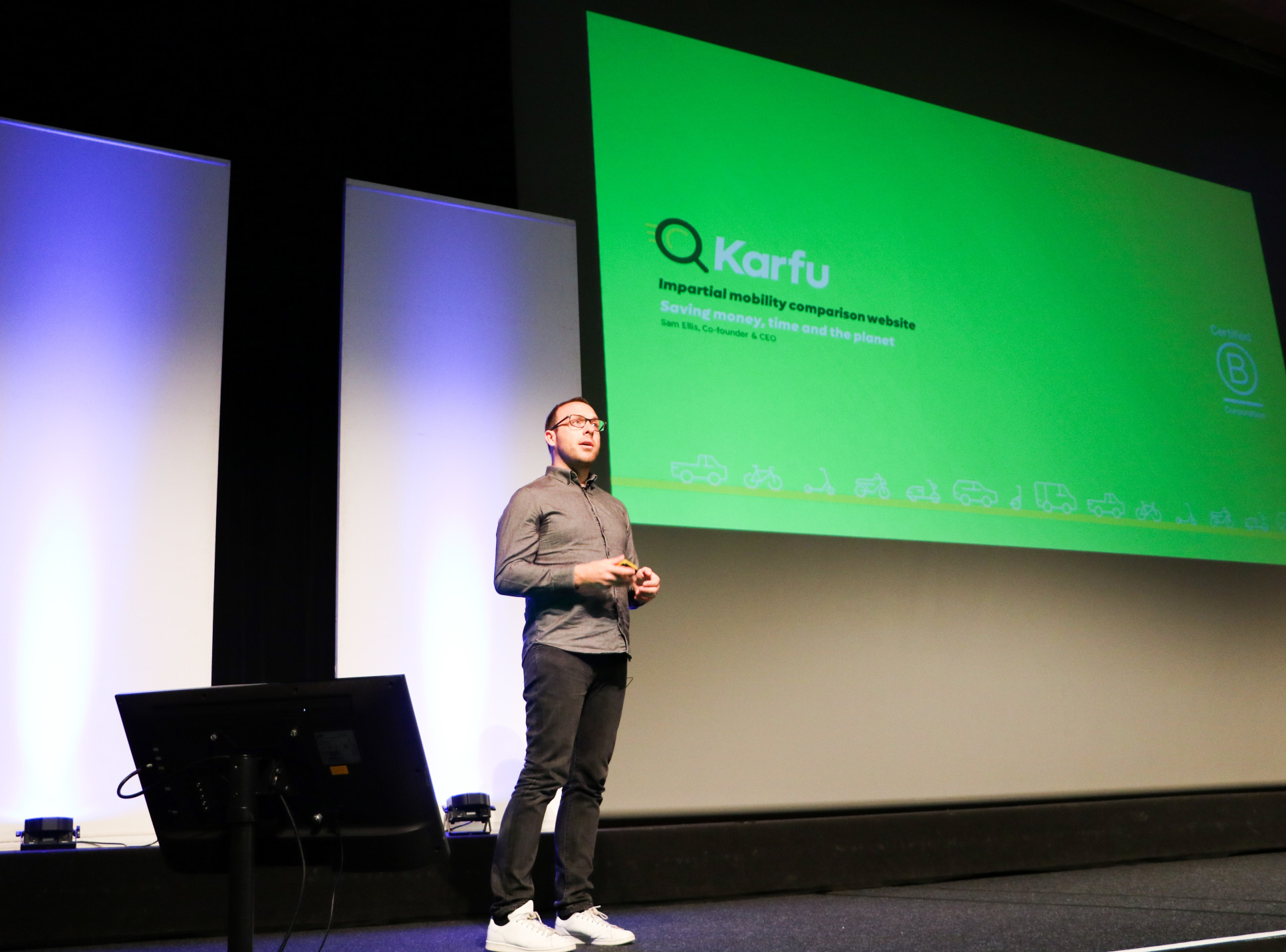 Sam Ellis, cofounder of Karfu, presenting in front of a screen