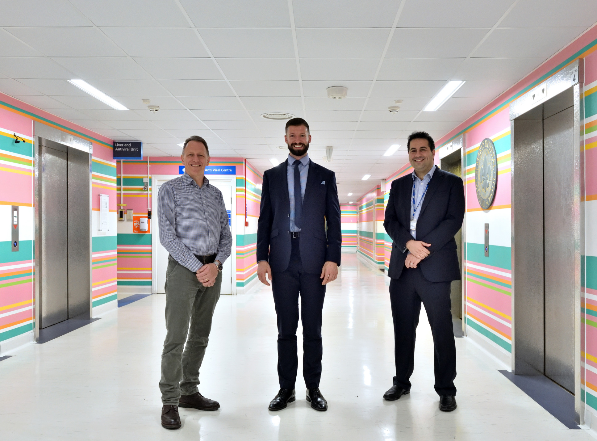 Dr Ben Mullish, Professor Julian Marchesi and Dr James McIlroy in a corridor