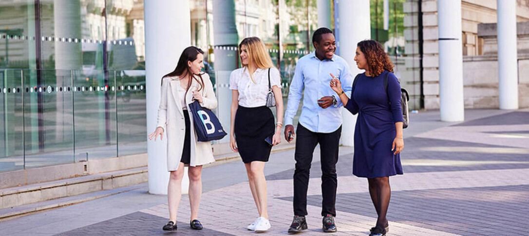Students walking to class chatting