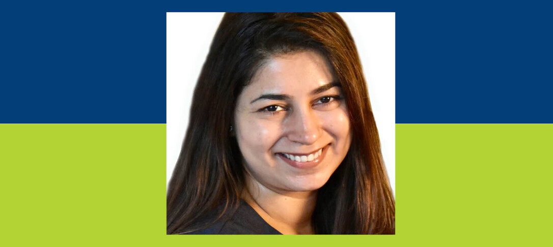 Portrait of Dr Devika Narain against blue and green background