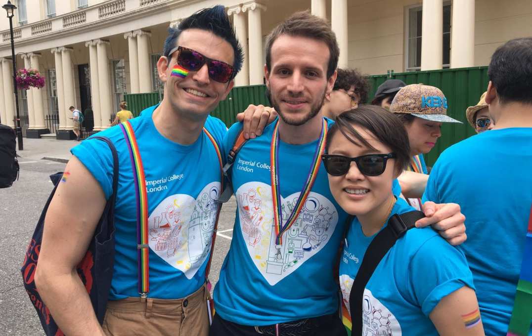 three people smiling in Imperial 600 tshirts