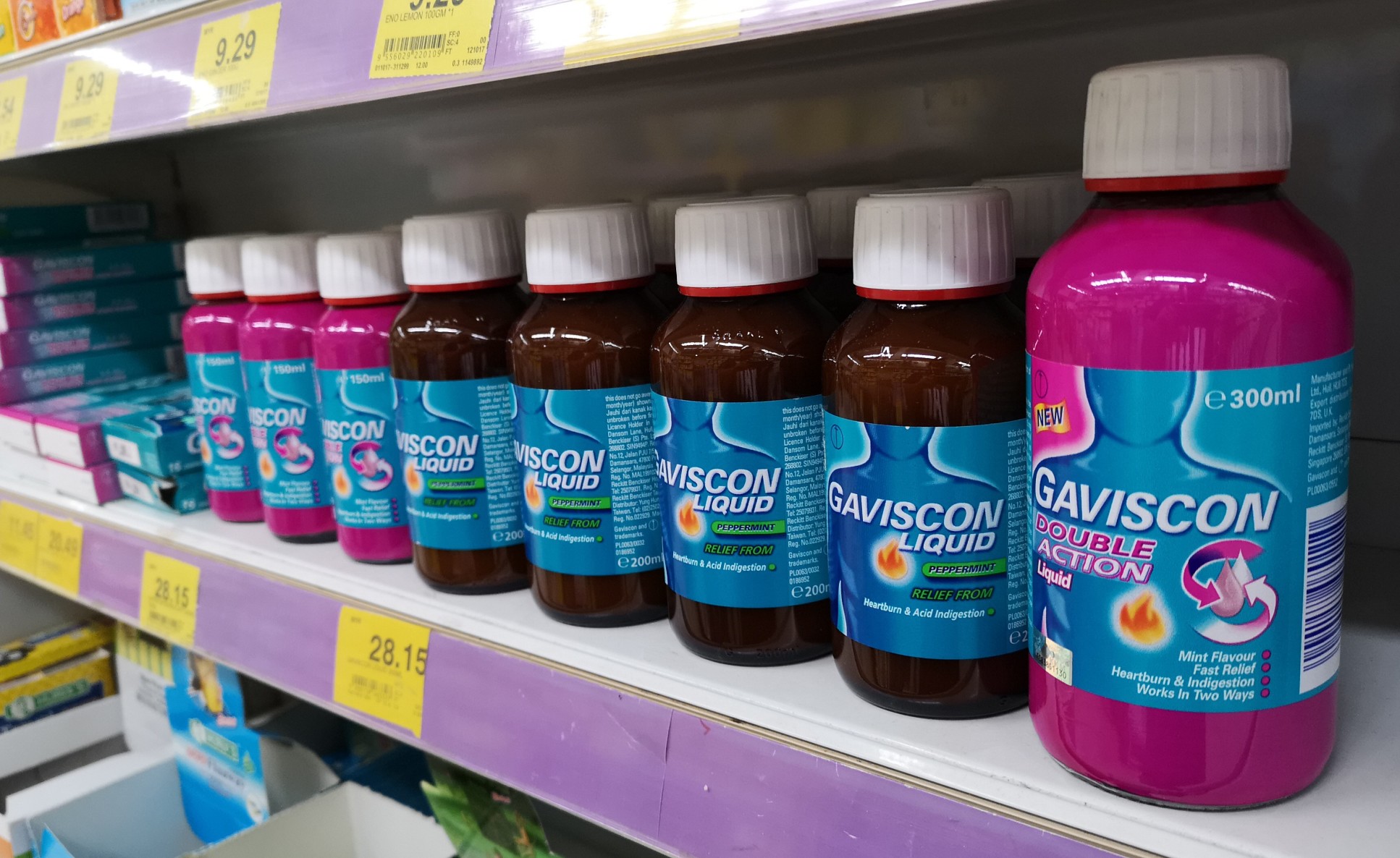 A shelf of Gaviscon indigestion products for sale in a shop.
