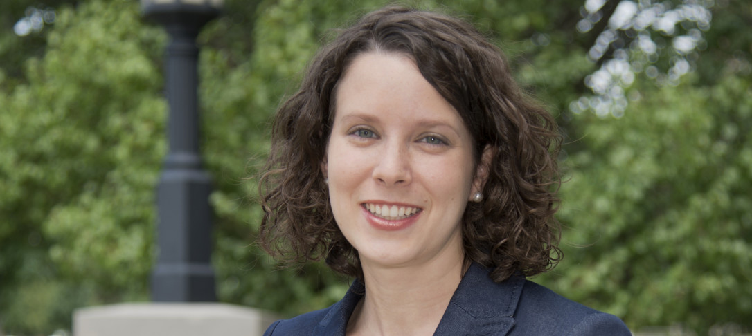 Woman with brown hair smiling at camera