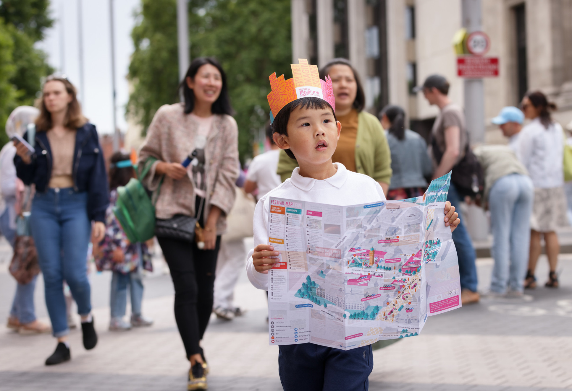 A boy holds a map