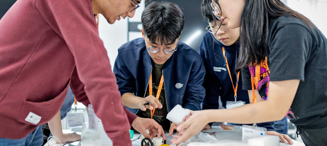 Students building a robot