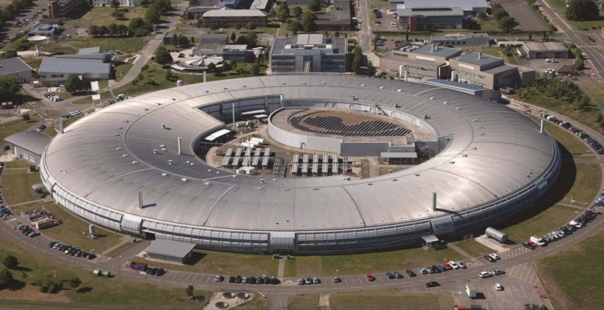A photo of a large circular building, the Diamond Light Source Synchrotron